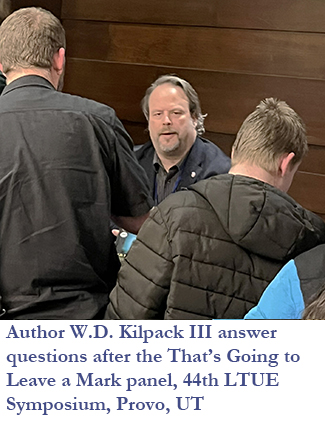 Author W.D. Kilpack III answering questions after the panel